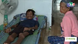 Elderly woman uses hands to support every step, caring for son with cancer and raising two grandc...