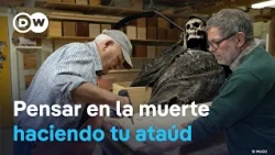 A carpenter helps build coffins to face death
