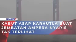 KABUT ASAP KARHUTLA BUAT JEMBATAN AMPERA NYARIS TAK TERLIHAT