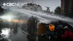Tens of thousands march in France protests before police respond with tear gas and water cannons