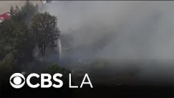 LAFD extinguishes brush fire that burned an Eagle Rock home