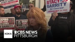 Stacy Garrity stands with skill game operators while speaking at rally